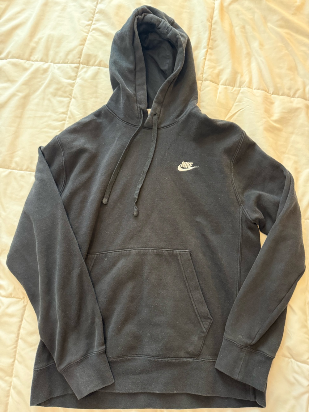 Women's Nike black jacket label close-up